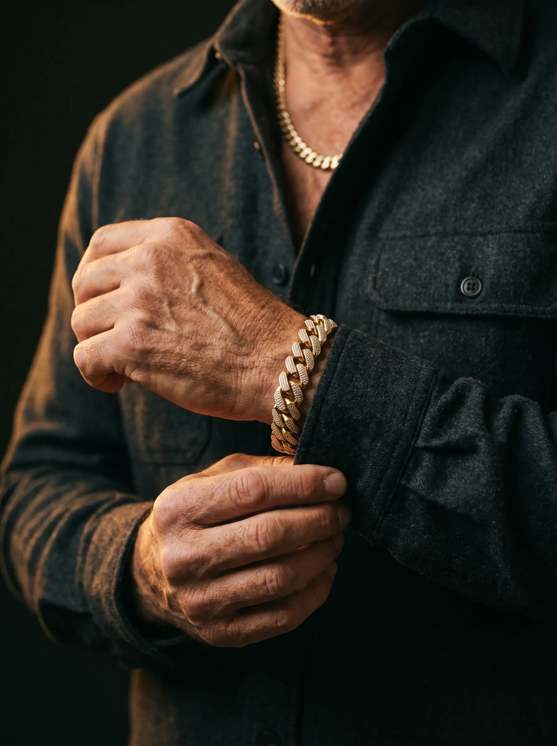 Iced gold Cuban bracelet and ring worn on the wrist