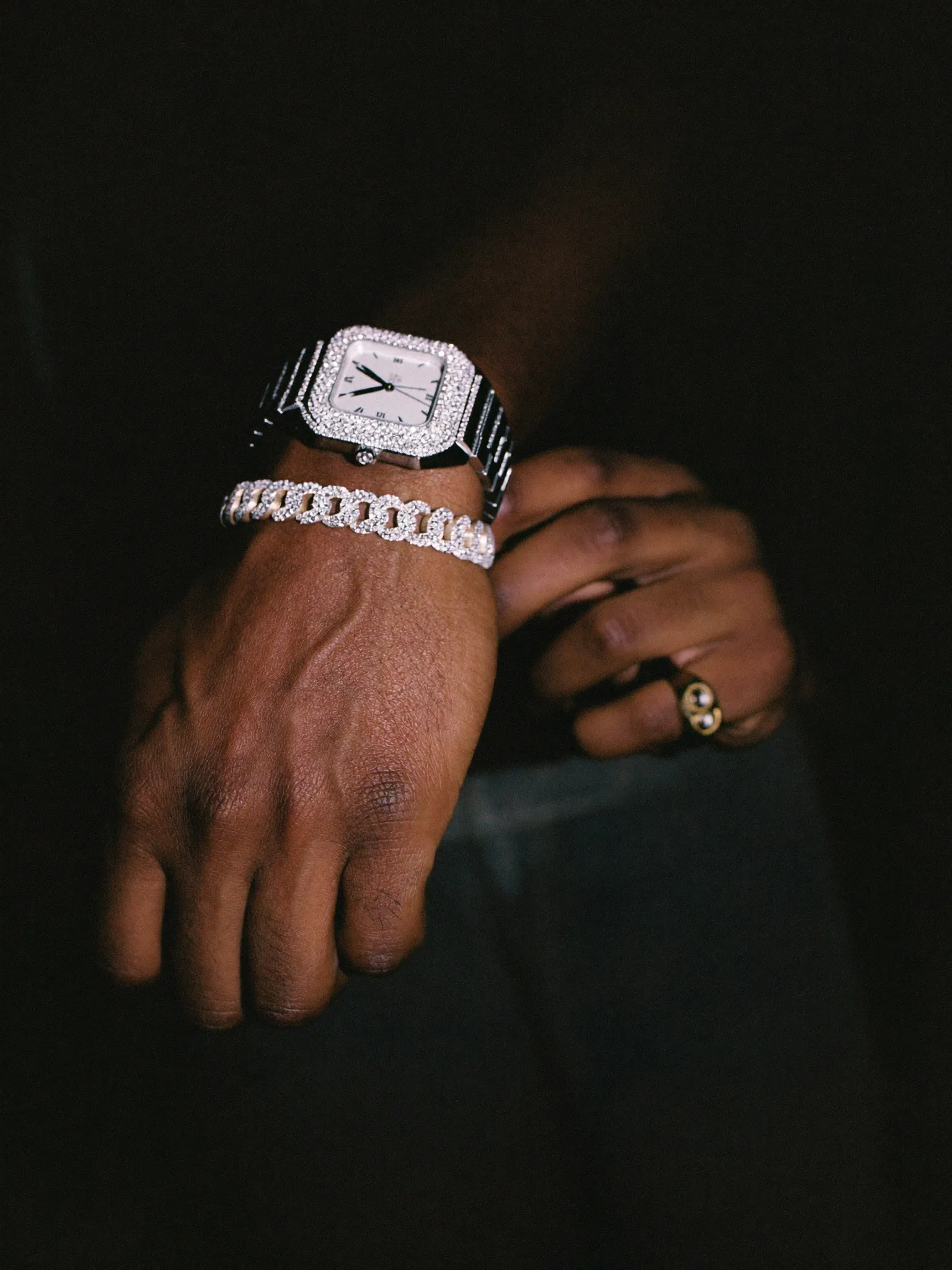 Wrist stack: iced watch, Cuban bracelet and tennis bracelet